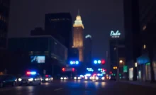 Police lights in a dark downtown Dallas street