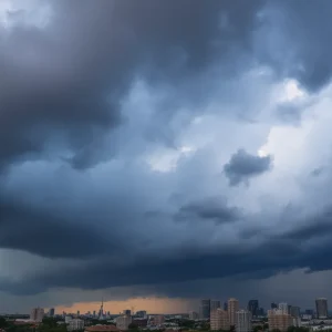 Dramatic clouds gather over the Dallas-Fort Worth skyline indicating severe weather.