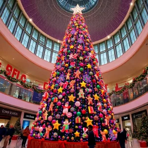 Tall indoor Christmas tree at Galleria Dallas with festive lights