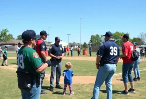 Community members enjoying the Battle of the Badges softball tournament at Railroad Park.